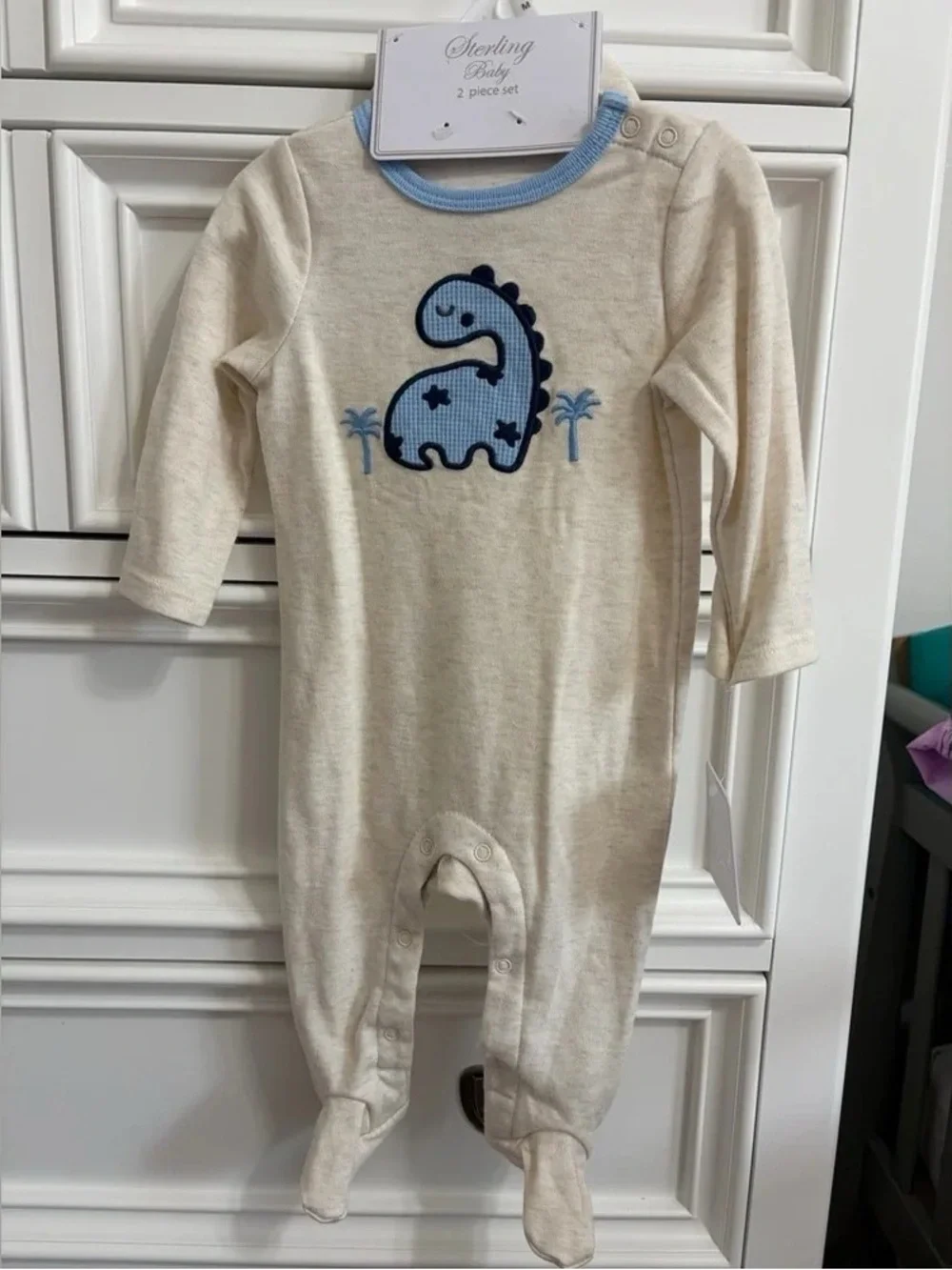 Cream One-Piece with Blue Dino Applique